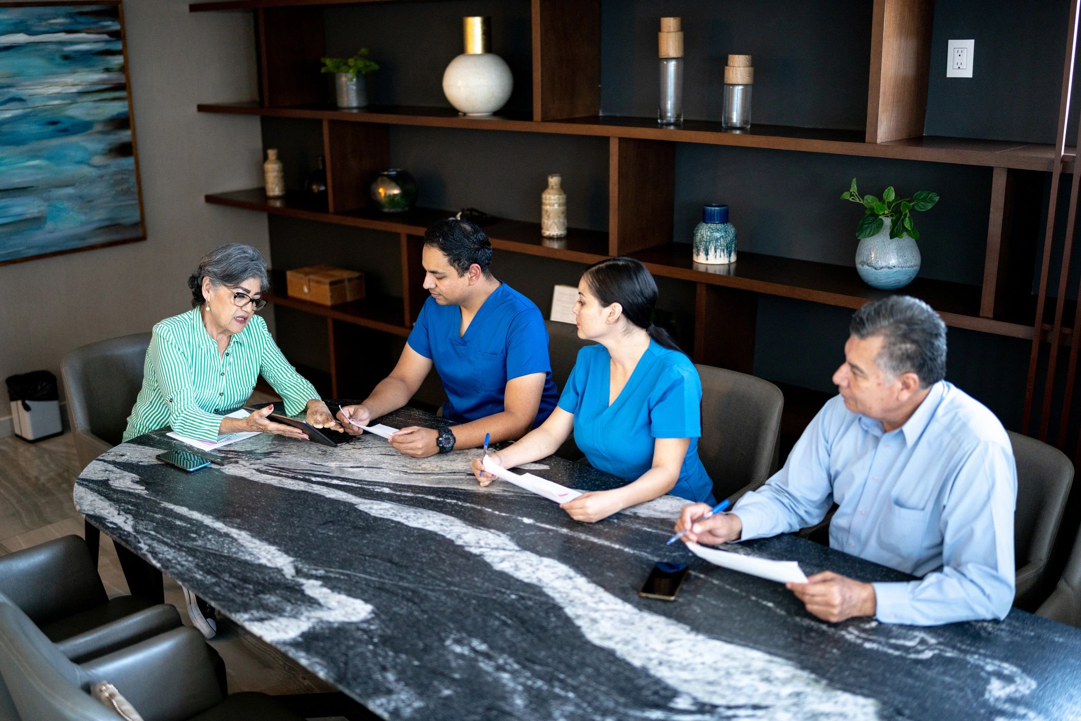 Senior care staff collaborating in a professional meeting