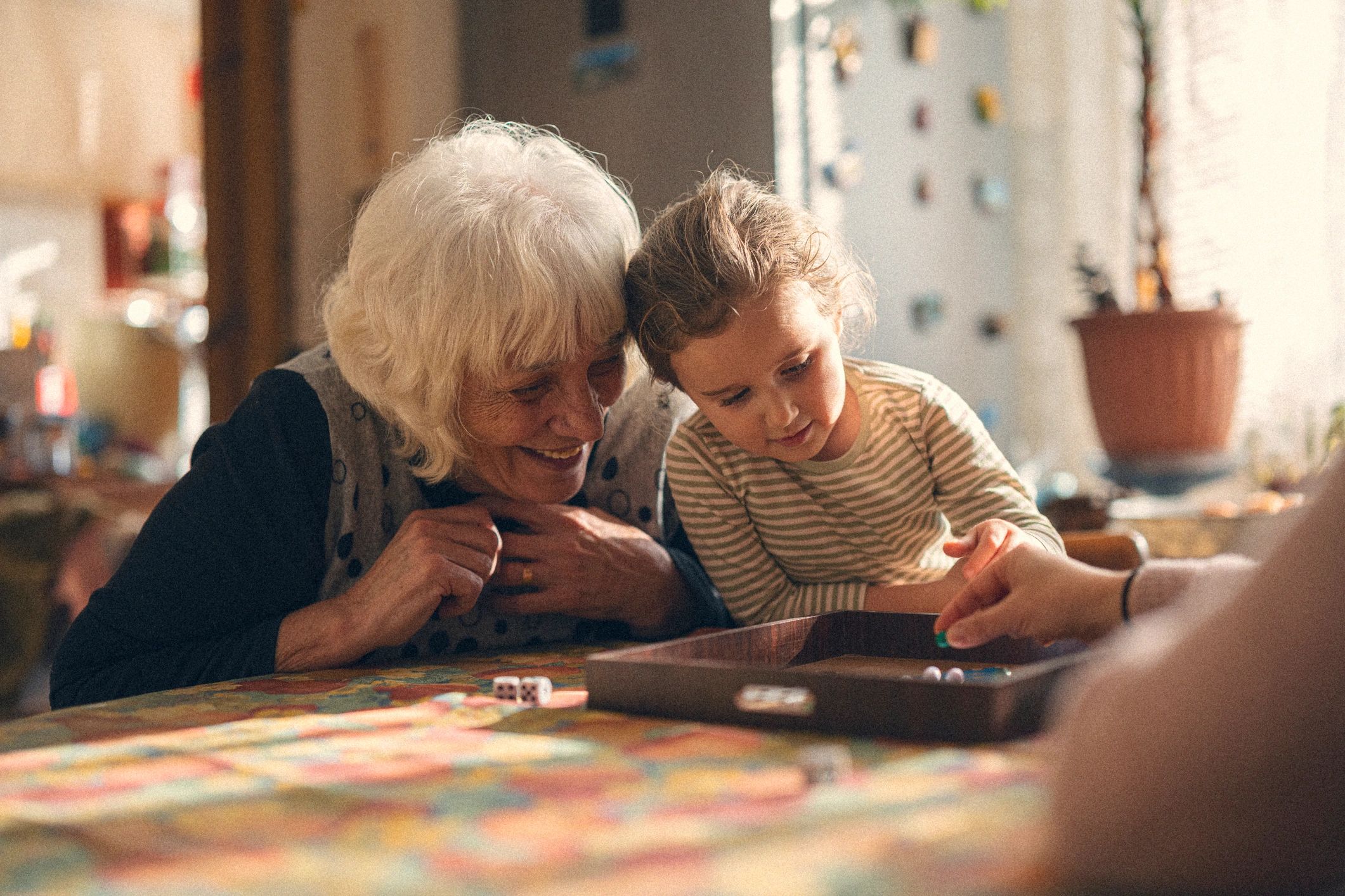 Family spending quality time with an older loved one in a comfortable home