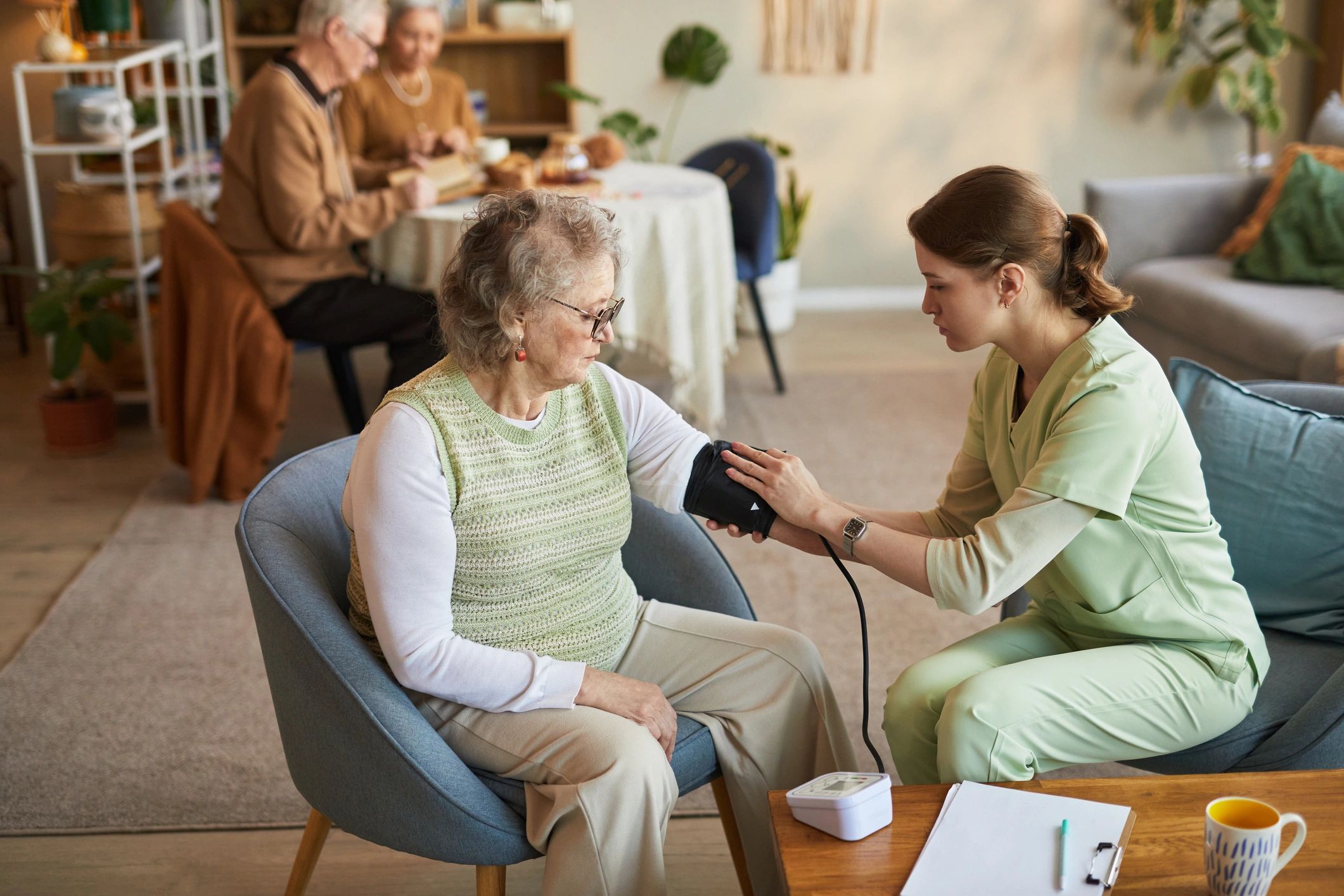 Care professional assisting a senior resident